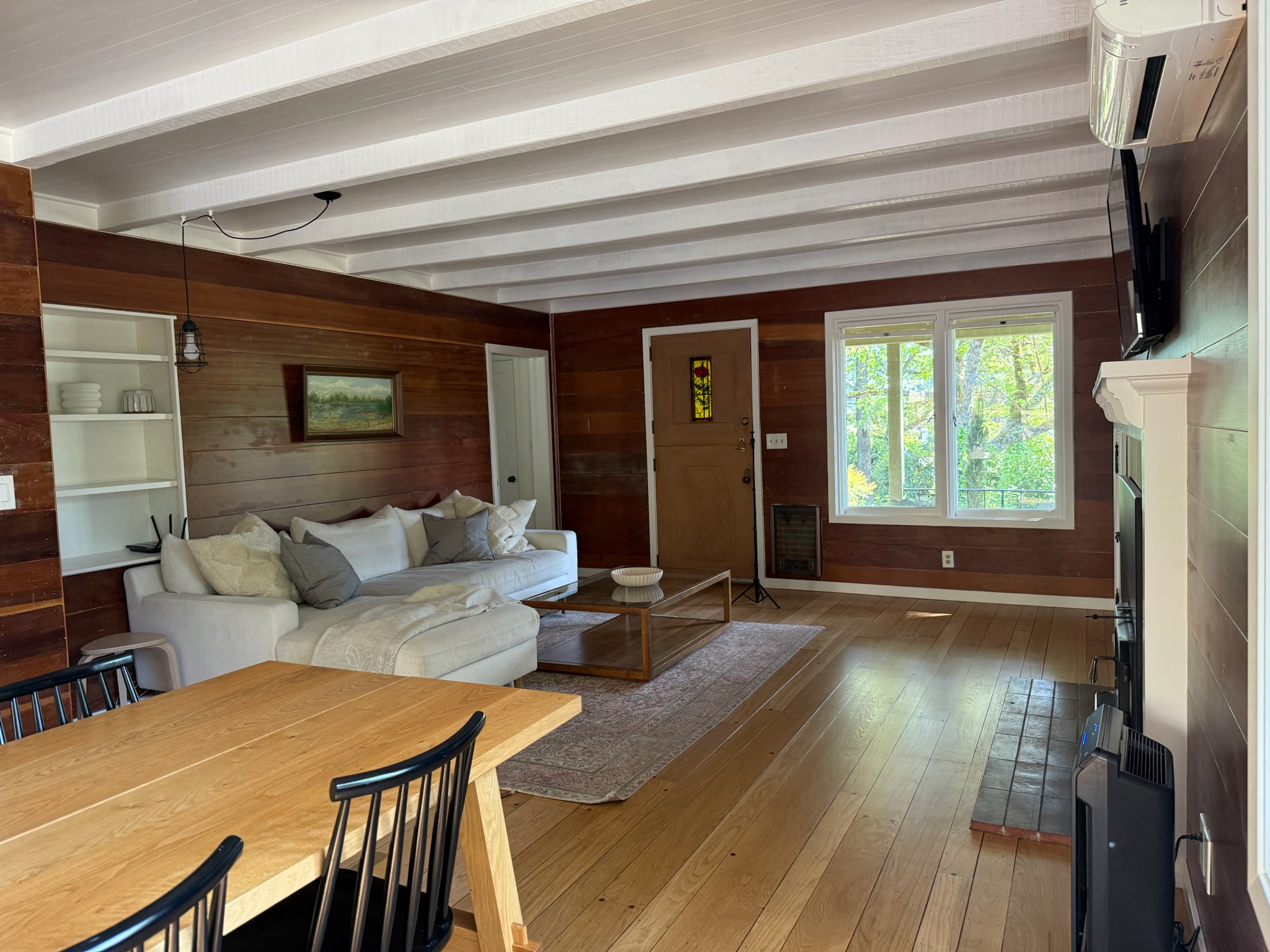 Classic wine country cottage with charming brick accents and lush greenery welcoming you home.